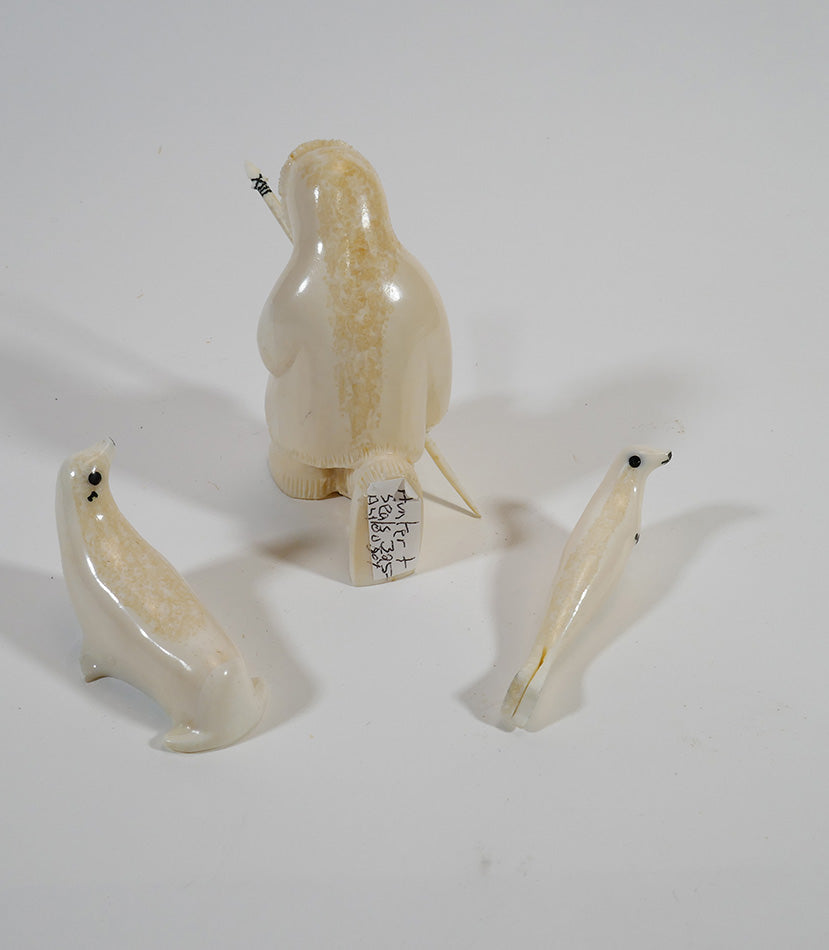 Alaskan Inuit/Eskimo Art Hunter with Two Seals Carved from Walrus Tusk