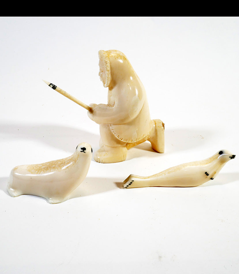 Alaskan Inuit/Eskimo Art Hunter with Two Seals Carved from Walrus Tusk