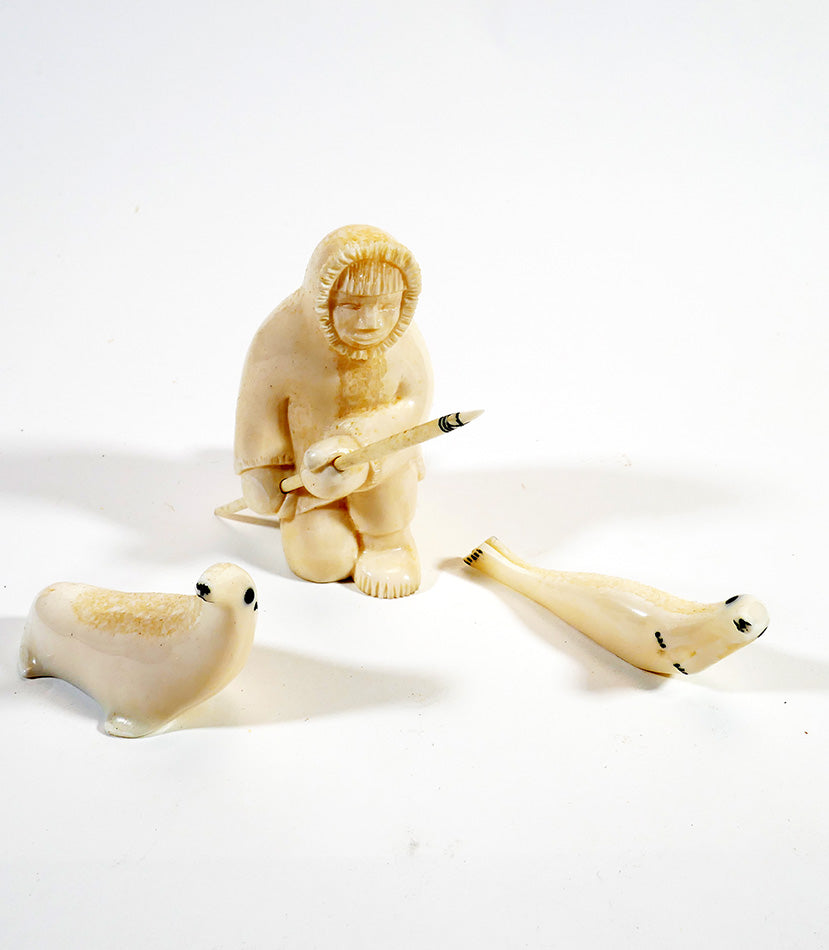 Alaskan Inuit/Eskimo Art Hunter with Two Seals Carved from Walrus Tusk
