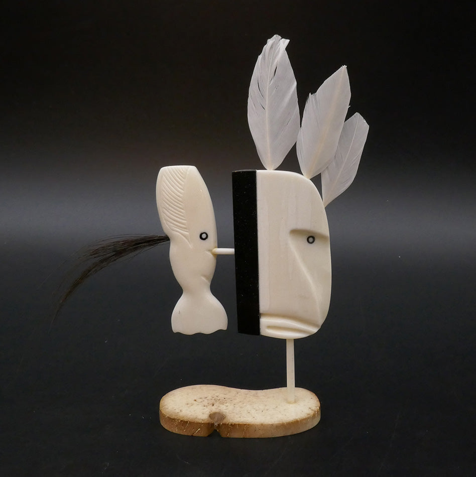 2 3/4 inches wide x 6 1/2 inches high (including feathers) x 1 1/4 inches deep