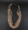 10-strand spiny oyster shell necklace with orange beads and olive shell heishi spacers, Kewa Santo Domingo, adjustable