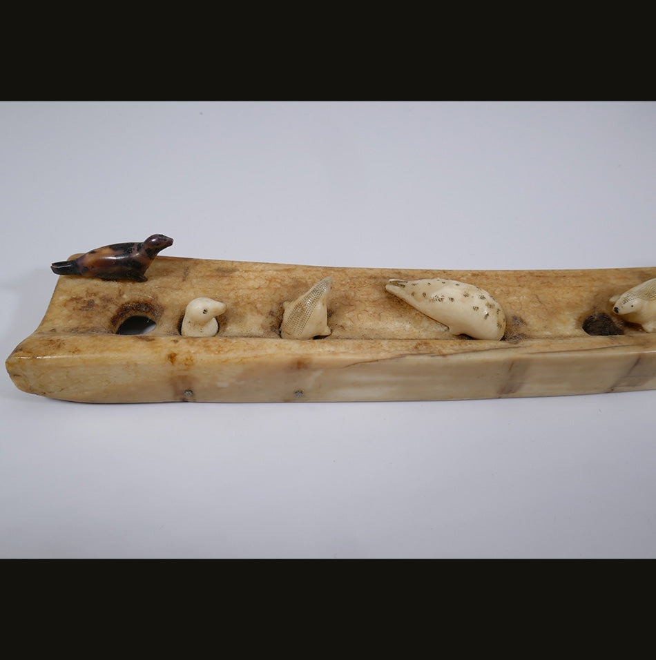 Ten seals on an ice flow Alaskan Eskimo Ivory